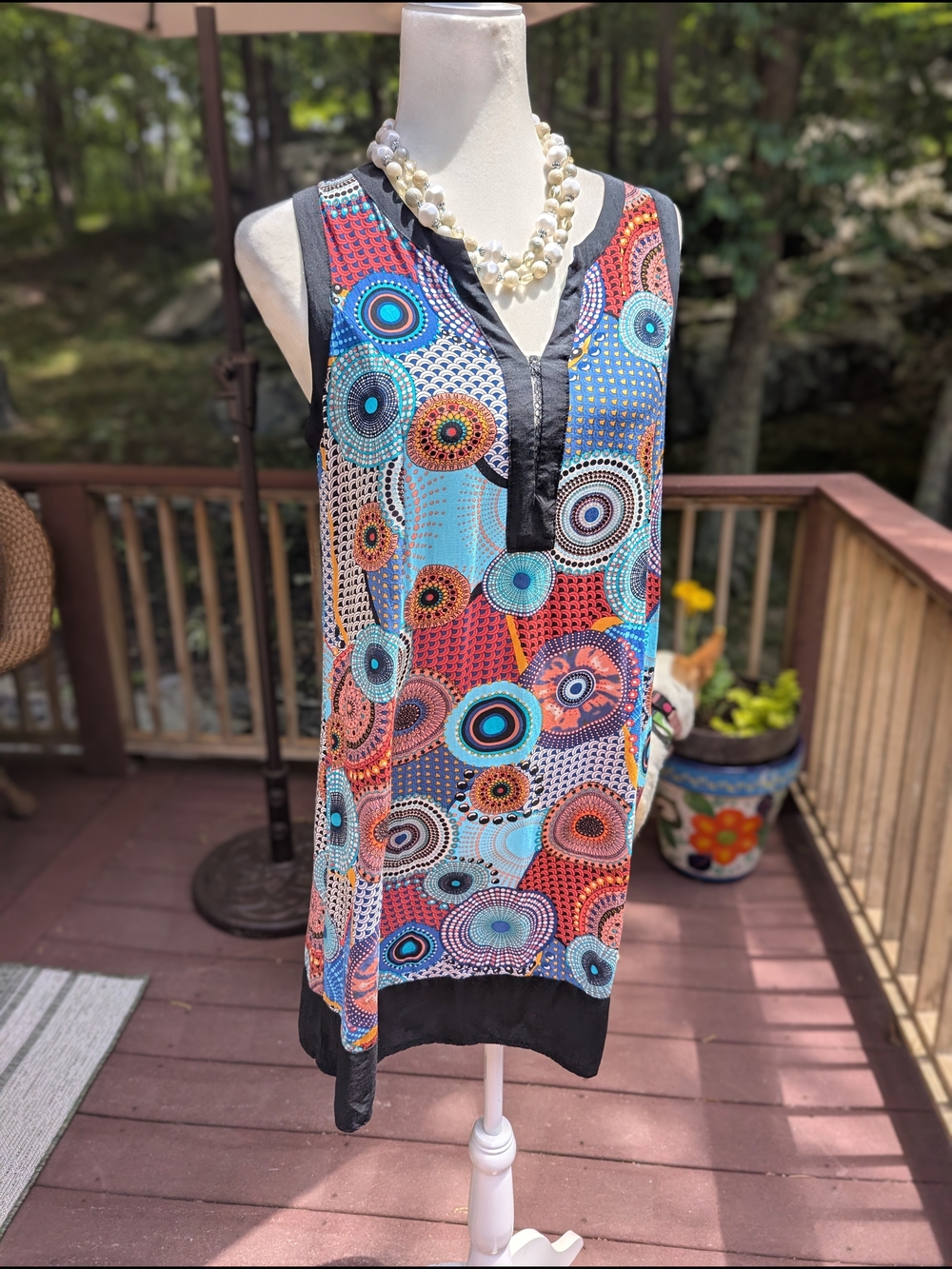 Sleeveless Multi-Color Circular-Print Tunic with Black Trim
